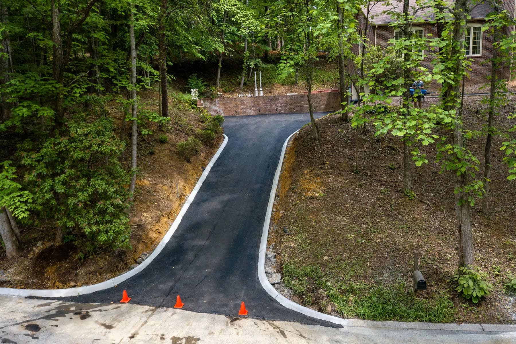 A friendly Hyder Paving expert providing a free on-site estimate for a driveway project in Johnson City, TN.