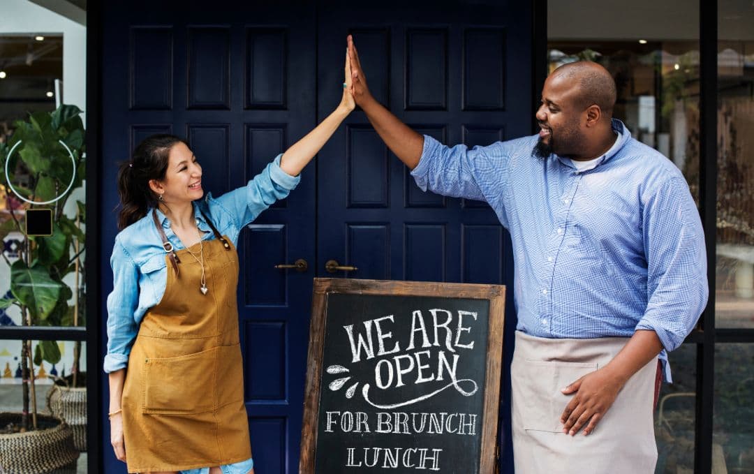 Smart business owners high-fiving